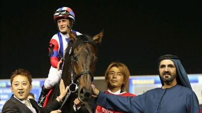 Sheikh Mohammed bin Rashid, right, with the Dubai World Cup-winning horse Victoire Pisa from Japan. Ali Haider / EPA