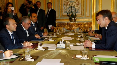 Lebanese foreign minister Gebran Bassil (L) and French president Emmanuel Macron (R) attend a meeting at the Elysee Palace in Paris, France, on November 14, 2017. Francois Mori / EPA
