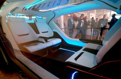 The car has four seats – the front two of which rotate so that they can either face forward or towards the other two passengers. Victor Besa / The National