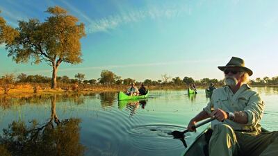 Active holidays, such as canoeing in Botswana, are becoming more popular. Beverly Joubert, National Geographic / Getty Images