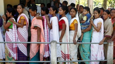 People line up to cast their votes outside a polling station in Majuli, a large river island in the Brahmaputra river, in the northeastern Indian state of Assam. Reuters