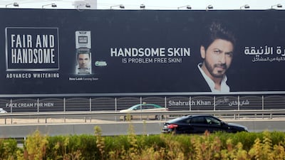 Shah Rukh Khan pictured in a billboard advert on Sheikh Zayed Road for the skin whitening cream Fair and Handsome. Chris Whiteoak / The National