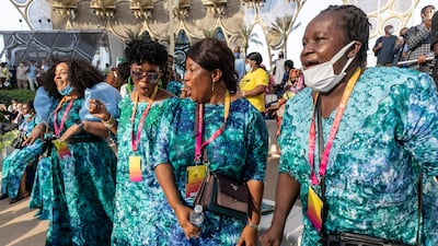 Visitors enjoying music from Sierra Leone at Al Wasl Plaza. (Photo: Antonie Robertson / The National)