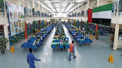 Workers have lunch during their mid-shift break. Christopher Pike / The National