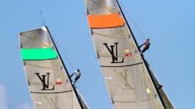 Two yachts vie for position during the race.