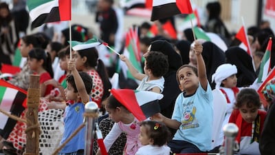Children take part in the 44th UAE National Day celebrations in Ajman in December 2015. Pawan Singh / The National