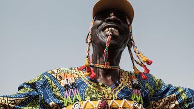 A member of traditional music and dance group performs before a rally for supporters of Sudan's ruling Transitional Military Council (TMC) in the village of Abraq, about 60km northwest of Khartoum. AFP