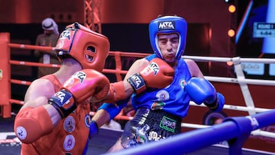 Yemen's Akram Alyminee, in red, in action against Hyan Aljmyah of Syria at the IFMA Asian Muay Thai Championship Abu Dhabi 2019. Victor Besa / The National