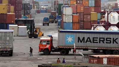 Containers are piled up at a terminal at the Jawaharlal Nehru Port Trust in Mumbai, India. Higher tariffs on 28 US products including almonds, apples and walnuts take effect from Sunday. AP