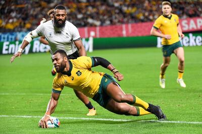 Australia centre Samu Kerevi scores a try during the Rugby World Cup 2019 Pool D match against Fiji at the Sapporo Dome in Sapporo. AFP