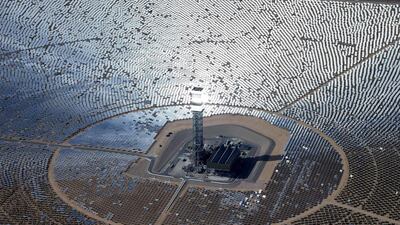 The 300,000 computer-controlled mirrors reflect sunlight to boilers that sit on 459-foot towers. The sun’s power is used to heat water in the boilers’ tubes and make steam, which in turn drives turbines to create electricity. Chris Carlson / AP Photo