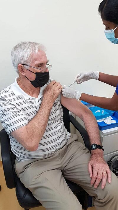 Graham Morton, 74, took the first shot of the vaccine on Wednesday evening in the Uptown Mirdif Medical Fitness Centre. Courtesy: Carolyn Morton