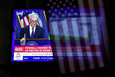 A screen at the New York stock exchange broadcasts a news conference by Fed Chair Jerome Powell following the rate announcement in September. Reuters