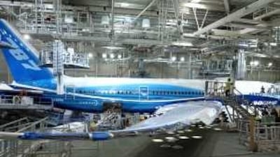 A Boeing 787 Dreamliner airplane sits in the paint hangar at the company's manufacturing plant in Everett, Washington, US.