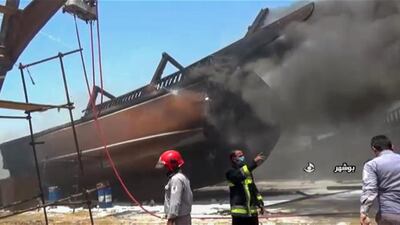 A screen grab taken from a from Iranian State TV Irib shows firefighters combatting a blaze at the Delvar Kashti Bushehr boat factory in the Iranian city of Bushehr. AFP PHOTO, HO IRIB
