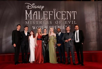 ‘Maleficent: Mistress Of Evil’ cast members Harris Dickinson, Sam Riley, Jenn Murray, Michelle Pfeiffer, Angelina Jolie, Elle Fanning, Chiwetel Ejiofor, Ed Skrein and director Joachim Ronning pose during the film's premiere in Los Angeles, California, on Monday, September 30, 2019. Reuters