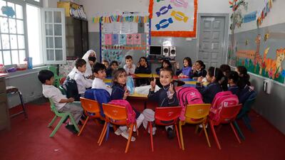 A nursery class poses for a photo at Khushal School and College.