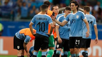 Edinson Cavani, right, and his teammates react to losing the Coap America quarter-final to Peru. AP Photo