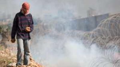 A Palestinian demonstrator takes part in a protest in the West Bank village of Nilin to mark the founding of the Fatah movement.