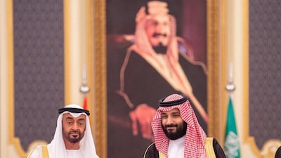 Abu Dhabi's Crown Prince Sheikh Mohammed bin Zayed poses for a photo with Saudi Crown Prince Mohammed bin Salman during the Saudi-UAE Summit in Jeddah. Reuters