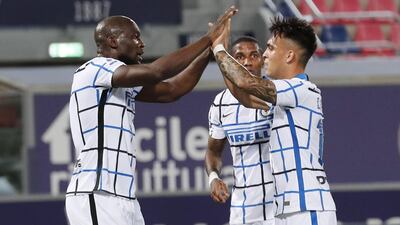 Inter's Romelu Lukaku celebrates with his teammate Lautaro Martinez after scoring against Bologna. EPA