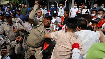 Chinese and Cambodian citizens believed to be Huione Pay creditors clash with police during a protest near the National Bank of Cambodia headquarters in Phnom Penh. AFP