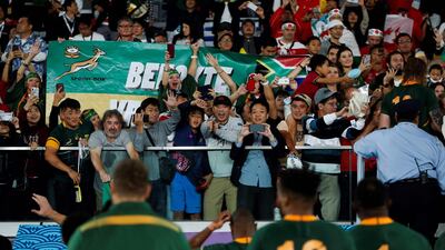 Fans wave at South Africa's players after they won the Japan 2019 Rugby World Cup semi-final match between Wales and South Africa at the International Stadium Yokohama in Yokohama. AFP