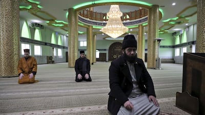 The staff of a Palestinian mosque pray at an empty building as all the mosques in the Hebron area are closed amids the coronavirus pandemic. AFP
