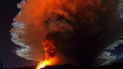 Large streams of red hot lava shoot into the night sky as Mount Etna, Europe's most active volcano, leaps into action, as seen from the village of Fornazzo, Italy. Reuters