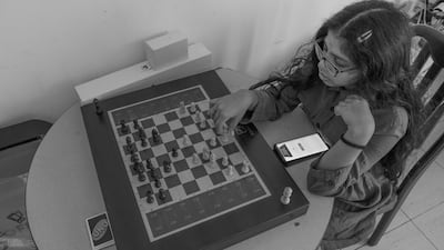 Vidhyaa Chandramohan's daughter playing chess. Vidhyaa Chandramohan
