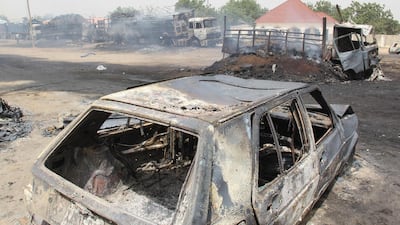 Cars in Auno torched by suspected members of Islamic State West Africa Province during an attack on February 9, 2020. AFP