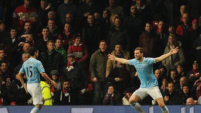 Edin Dzeko, right, scored twice for Manchester City on Tuesday. Peter Powell / EPA / March 25, 2014