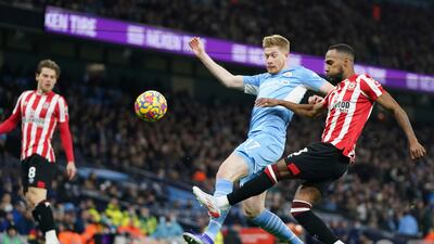 City's Kevin De Bruyne is put under pressure by Brentford's Rico Henry. AP