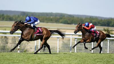 William Buick riding Wild Illusion, left, win the Nassau Stakes at Goodwood Racecourse. Getty Images