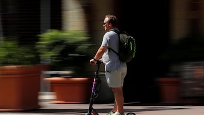 An e-scooter commuter in San Diego, California. Mike Blake / Reuters
