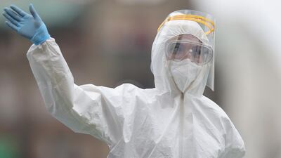 A medical soldier wearing a face mask salute towards President Andrés Manuel López Obrador during the Independence Day military parade at Zocalo Square in Mexico. Getty Images