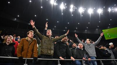 Tottenham Hotspur fans watch on. Reuters