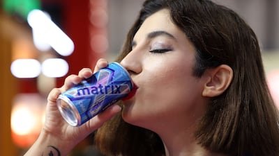 A drinks rep tries Jordanian-made Matrix Cola at the Gulfood exhibition in Dubai. Chris Whiteoak / The National