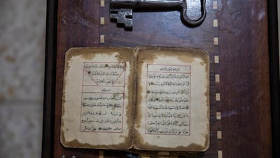 A 200 years old hand written copy of the Muslims holy book the Quran, and an old house key belonging to the family of Palestinian refugee Palestinian refugee Hana Khalel Emselem Edieb, on a table in Baqa'a Palestinian refugee urban camp, near Amman, Jordan. Ms. Abu Kecheck is originally from a village near Yafa in what used to be Palestine, she left her village with her family to flee expected violence first around 1948 but as an internally displaced person. She moved out again to Kuwait to follow her husband in 1960, but they had to leave Kuwait and move to to Baqa'a Palestinian refugee urban camp in the wake of the first Gulf War in 1990. World Refugee Day is marked annually on 20 June. EPA