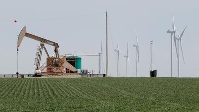 Above, an oil derrick and wind turbines north of Amarillo, Texas. Lucas Jackson / Reuters