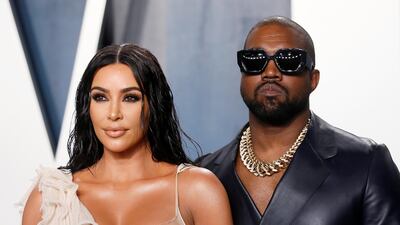 Kim Kardashian and Kanye West attend the Vanity Fair Oscar party in Beverly Hills in February. Ms Kardashian West's talks to sell her beauty care line to cosmetics giant Coty has hit a stumbling block after existing partner Seed Beauty filed an injunction blocking the deal. Reuters