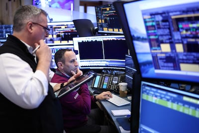 Traders work on the floor of the New York Stock Exchange. AFP
