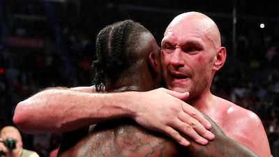 Deontay Wilder and Tyson Fury react after the fight. Reuters