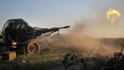 A picture made available on 24 August shows a pro-Ukrainian Donbass battalion fighter firing at pro-Russian rebels with an anti-aircraft gun in Ilovaysk, 50km from Donetsk in Ukraine. Ivan Boberskyy/EPA