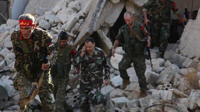 Syrian pro-government soldiers patrol the area of Awijah as they advance in Aleppo's rebel-held neighbourhoods, on October 8, 2016. AFP / GEORGE OURFALIAN