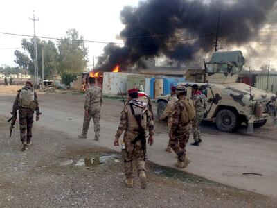 Iraqi soldiers patrol a street in Sa'adiya town northeast of Baghdad, Iraq, 24 November 2014. EPA