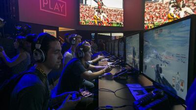 Attendees play Electronic Arts’ Star Wars Battlefront at the E3 Electronic Entertainment Expo at Los Angeles Convention Center. Damian Dovarganes / AP Photo