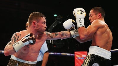 MANCHESTER, ENGLAND - FEBRUARY 27: Carl Frampton (L) and Scott Quigg in action during their World Super-Bantamweight title contest at Manchester Arena on February 27, 2016 in Manchester, England. (Photo by Alex Livesey/Getty Images)