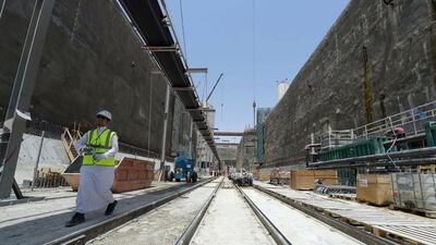 Above, a construction site at the Riyadh Metro. Saudi Arabia has kepts to its pledge to maintain spending this year despite weaker oil prices. Ahmed Farwan / AFP