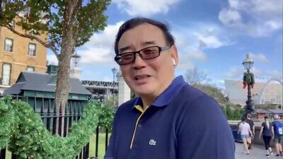 Australian writer Yang Hengjun wishes Happy New Year to his Twitter followers from an undated video obtained via social media. Twitter @YANGHENGJUN